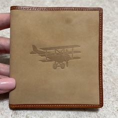 Smooth Fine Calf Leather With Embossed Antique Airplane 10 Credit Card Slots 1 Bill Compartment Lined In Plaid Flannel Fabric Retails For $139 Small Leather Imperfection On Front Right Hand Corner Hardly Noticeable. Doesn’t Take Away From This Vintage Wallet 4” Folded X 8 W X 4.5”H Plaid Flannel Fabric, Vintage Wallet, Saddle Brown, Flannel Fabric, Plaid Flannel, Right Hand, Aeropostale, Tan Brown, Calf Leather