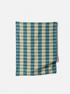 a blue and green checkered napkin on a white background