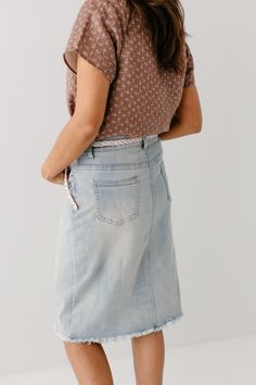 Light wash denim is a must have for any spring/summer wardrobe! Made from a soft and stretchy denim, this raw hem denim skirt is on trend! The knee length 'Lily' brings all the style and still keeps it classy with a flattering, modest fit! 97% Cotton/3% Spandex Wash Cold Gentle Cycle Hang to Dry Light Distressing Soft, Stretchy Denim Model Height 5'5" | Wearing Size 4 Wearing 'Maria' Floral Cotton Top & 'Lily' Light Denim Knee Length Skirt Please carefully measure a similar item before placing y Denim Skirts Knee Length, Spring Summer Wardrobe, High Waisted Denim Skirt, Denim Skirt Outfits, Modest Fits, Keep It Classy, Printed Midi Skirt, Knee Length Skirt, Light Wash Denim