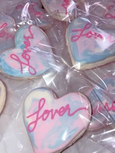 some heart shaped cookies are wrapped in plastic