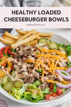 a white bowl filled with cheeseburger bowls and french fries on top of it