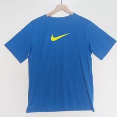 Nike Dri-Fit T-Shirt, Size Xl, Nwot, Tags Removed & Never Worn. Made From Rich Cotton Fabric Crew Neck And Short Sleeves Interior Taping To Neck For Durability Regular Fit Nike Swoosh Branding Chest Print Ptp 21" Length 27 Bin 22 Yellow Sports T-shirt With Logo Print, Yellow Sports T-shirt With Logo, Nike Blue Short Sleeve T-shirt, Yellow Graphic Tee For Sports, Yellow Nike T-shirt With Short Sleeves, Nike Blue Crew Neck T-shirt, Nike Yellow Short Sleeve T-shirt, Blue Nike T-shirt With Logo Print, Nike Blue T-shirt With Logo Print