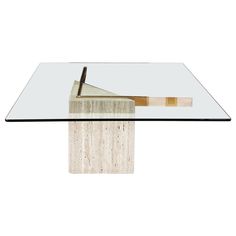 a table with a glass top and a wooden stick sticking out of it's end