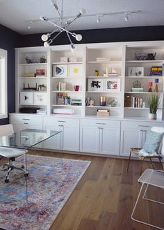 a living room filled with furniture and a rug