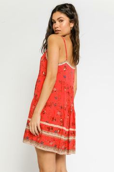 Final Sale - Get it before its gone! The Having A Moment Red Floral Swing Dress is going to be your go-to dress this summer! Stand out in this red floral print dress that forms a straight neckline with adjustable spaghetti straps. The relaxed swing silhouette continues down to a mini hem. Features a contrasting border trim on neckline and hemline and pearlized button-down bodice. Style with brown sandals for the perfect boardwalk outfit this summer. DETAILS & CARE Rayon. Machine Wash Cold. Impor Floral Print Sundress With Straight Neckline, Spaghetti Strap Sundress In Rayon, Summer Sundress With Floral Print And Straight Neckline, Floral Print Sundress With Straight Neckline For Summer, Red Mini Dress With Adjustable Straps, Vacation Rayon Mini Dress With Spaghetti Straps, Vacation Mini Dress With Spaghetti Straps In Rayon, Red Spaghetti Strap Sundress For Vacation, Red Sundress With Spaghetti Straps For Vacation