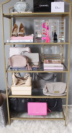 a gold shelf filled with purses and handbags