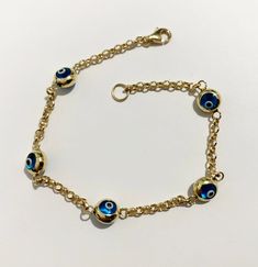 "work of art stylish lucky charm thick solid gold Evil eye bracelet metal    : solid 10k yellow gold weight  = 3 gr evil eye = 7 mm width cable chain = 2 mm  length   = 7.50\"inch will arrive packed in jewelry box we offer free shipping around the world" Gold Charm Bracelet With Evil Eye, Gold-plated Yellow Gold Evil Eye Bracelet, Gold Plated Evil Eye Bracelet, Gold Evil Eye Bracelet, Solid Gold Bracelet, Bracelet Metal, Gold Bracelet For Women, Evil Eye Pendant, Gold Snake