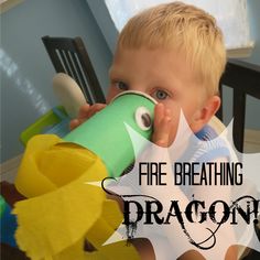 a young boy sitting in a chair drinking out of a paper cup with the words fire breathing dragon on it