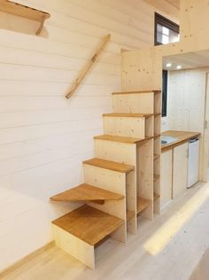 the stairs are made out of plywood and have been built into the wall for storage