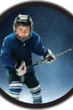 an image of a hockey player in uniform and helmet holding a stick with both hands