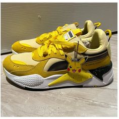 Pokemon X Puma - Picachu. New, Never Worn. Fits A Womens Size 7 - Youth 5.5. Has Removable Picachu Keychain. Playful Yellow Lace-up Sneakers, Playful Yellow Sneakers With Round Toe, Yellow Sporty Sneakers With Puma Logo, Sporty Yellow Puma Sneakers, Sporty Yellow Sneakers With Puma Logo, Yellow Low-top Puma Sneakers, Yellow Lace-up Puma Sneakers, Pokemon Shoes, Puma Shoes