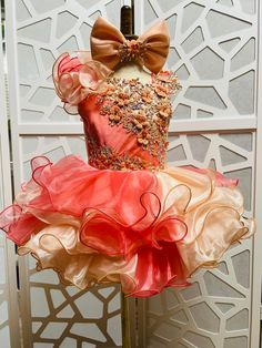 Gorgeous custom coral peach  baby doll cupcake little girls dress. Multi layered skirt with organza  ruffles .  The top is decorated with crystals and flowers. Included hair bow with crystals and gems. It is a one piece dress. Lacing  back. Colors: orange, apricot, peach, coral. Can be made in any size. Ready to ship in other color in 3 weeks. Hand washing in cold or warm water. Delicate (not hot) iron for organza Toddler Pageant Dresses, Pagent Dresses, Wedding Peach, Pageant Outfits, Monsoon Dress, Pageant Wear, Pageant Girls, Flower Romper, Girls Easter Dresses