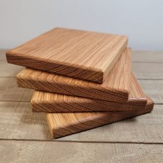 three pieces of wood stacked on top of each other