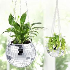 two hanging planters with plants in them, one is made out of mirror tiles