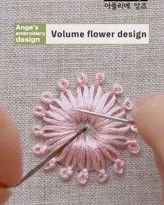 the needle is being used to crochet flowers