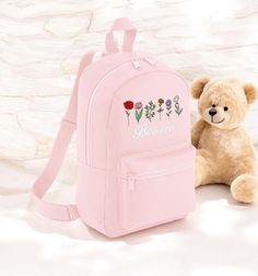 This gorgeous personalised backpack is perfect for everyone! A must have for back to school or starting nursery each bag is handmade to order and can feature your choice of name as shown! The beautiful design is embroidered in stunning full colour for longevity and class. Excellent as a nursery or school bag or even just a general day bag, the backpack measures 23 x 35 x 12 cm and has a Capacity of 7 Litres giving lots of space for all the essentials. Made from a durable polyester the bags have Pink Softback Backpack For Gift, Personalized Pink Everyday Backpack, Personalized Backpack For Back To School, Personalized Pink Bag For Back To School, Pink Bags For Back To School Personalized Gift, Embroidered Backpack, Rucksack Bag, Personalized Backpack, Monogram Wreath