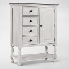 a white wooden cabinet with drawers on one side and an open drawer on the other