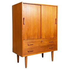 an old wooden armoire with two doors and three drawers on one side, against a white background