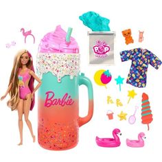 a barbie doll is standing next to a coffee cup and other items that include swimsuits