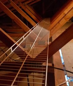 the stairs are made of wood and wire in order to reach up high on the roof