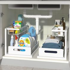 an open dishwasher with dishes and detergents in the bottom shelf next to it