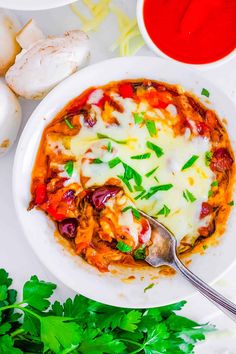 a white bowl filled with lasagna sauce and garnished with parsley