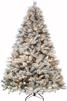 a white christmas tree with lights and snow on the top, in front of a white background