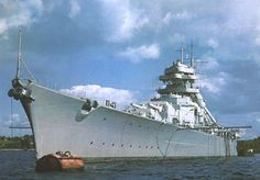 a large white ship floating on top of a body of water