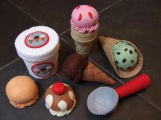 an assortment of ice cream and desserts on the floor