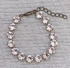 This listing is for this Gorgeous 8mm Silk Swarovski Crystal on brass ox plated bracelet. Bracelet measure 6.5 inches with 2 inches extender chain with an lobster claw clasp. This is an attention getter bracelet its just gorgeous! Great to give to that someone special in your life <3  Your Swarovski Bracelet is packed with care and placed in a gift box and inside of a beautiful organza bag. PLEASE READ BEFORE PLACING YOUR ORDER: FREE SHIPPING FOR ORDERS OVER $35.00 Offer ONLY Eligible in the Uni Attention Getters, Swarovski Bracelet, Photo Box, Tennis Bracelet, Organza Bags, Chain Link Bracelet, Ox, Statement Jewelry, Lobster Claw