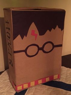 a harry potter box sitting on top of a bed