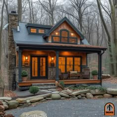 a small cabin in the woods with lights on and stone steps leading up to it