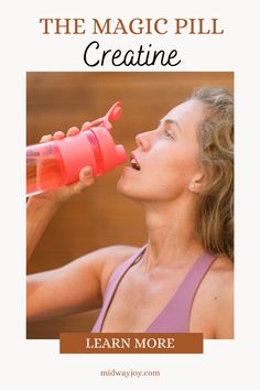 a woman drinking from a pink water bottle