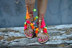 Multicolor tie up boho   leather sandals  embellished in pink ,yellow,green,orange pom poms and charms .Colourful and happy for all day long. Ideal for a perfect bohemian style. ♕ Designed to hold feet with minimal coverage and maximum stability ☀ Authentic Greek handmade ☆ Vegetable - tanned vachetta leather insole ☆ Anti-slip Italian SVIG sole ☆ Genuine leather straps ☆ Extremely flexible & lightweight - easy to walk ☆ An awesome Shoe-Box  All of our sandals are handmade in Greece in our works Bohemian Flat Lace-up Sandals For Beach, Summer Vacation Toe Ring Sandals With Round Toe, Summer Toe Ring Sandals With Round Toe, Party Lace-up Open Toe Sandals For Beach Season, Bohemian Adjustable Flat Lace-up Sandals, Bohemian Flat Sandals For Summer, Bohemian Round Toe Sandals For Beach Season, Summer Party Lace-up Open Toe Sandals, Casual Toe Ring Sandals For Summer Festivals