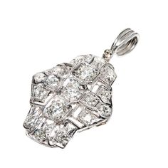 1940s handmade open work pendant set with European and transitional cut diamonds. Hinged handmade Platinum bail. 3 old European cut diamonds approximate total weight .60cts. 14 European cut diamonds approximate total weight .70cts, G-H, VS1-SI1. Tested: Platinum. 5.0 grams. 1 x ¾ inch without bail. Bail: 7/16 x 1/8 inch. Antique Earrings Vintage, Antique Sapphire Rings, Platinum Pendant, Antique Wedding Bands, Diamond Sapphire Engagement Ring, Antique Engagement Rings Vintage, Blue Sapphire Pendant, Antique Jewelry Necklace, Antique Bracelets