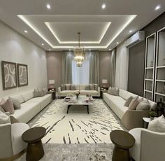 a living room filled with lots of white furniture