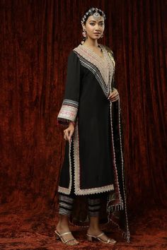 Black kurta in silk chanderi base with pearl, badla, kasab work and maroon lace trims on border, neckline and cuffs. Comes with a matching silk chanderi pant and floral pattern dupatta with gota, dori and crystal drop detailing. - Aza Fashions Elegant Black Art Silk Dupatta, Formal Silk Salwar Kameez With Cutdana, Elegant Art Silk Churidar For Designer Wear, Silk Dupatta For Formal Navratri Festival, Silk Dupatta For Formal Navratri Occasion, Silk Dupatta For Formal Wear During Navratri, Formal Silk Dupatta For Navratri, Elegant Designer Unstitched Suit With Cutdana, Elegant Designer Wear Unstitched Suit With Cutdana