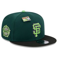 a green and black baseball cap with the san francisco giants on it