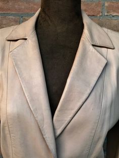 jacket or blazer for your spring, smooth lamb leather, cream color, maison Valentino, vintage 90's BRAND Valentino SIZE 10 CONDITIONS pre- loved in good conditions, slight flaws Please wash in specialized laundry only PRICE REFLECTS CONDITIONS in prizing this item we considered flaws and laundry PLEASE NOTE Vintage item, slight wear is expected please carefully look and zoom pictures and read description till the end All sales are final, returns or exchange accepted if the item is grossly misrep Beige Leather Blazer For Office, Vintage Beige Fitted Leather Jacket, Fitted Vintage Beige Leather Jacket, Beige Leather Blazer For Spring, Elegant Cream Leather Jacket, Elegant Cream Leather Jacket For Spring, Elegant Cream Long Sleeve Leather Jacket, Elegant Long Sleeve Cream Leather Jacket, Valentino Vintage