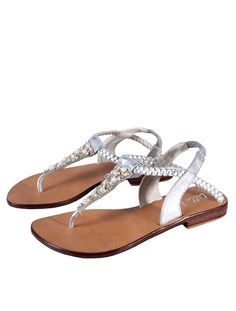 Experience luxury with the Athena Pearl Sandal. Handcrafted with precision, this stunning sandal features farmed pearls, beads, and crystals expertly placed for a unique and eye-catching design. The soft leather footbed offers comfort and durability, while the slip-on design and elastic back provide a secure fit. Perfect for special occasions or everyday elegance. -Smooth leather lining and insole -Lightly padded footbed-Wooden outsole-ankle strap-Pearl upper design -Open toe style Pearl Sandals, Everyday Elegance, Everyday Wardrobe, Smooth Leather, Leather Sandals, Soft Leather, Ankle Strap, Open Toe, Metallic Silver