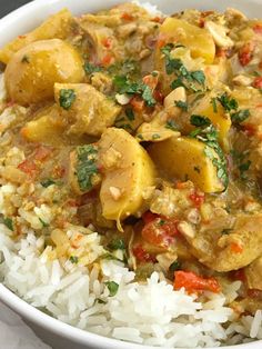 a white bowl filled with rice and chicken curry