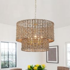 a chandelier hanging over a dining room table