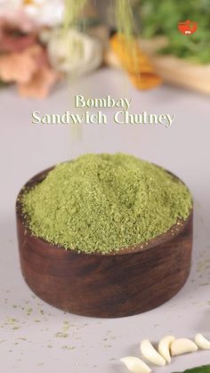 a wooden bowl filled with green powder