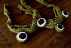 two crocheted eyeballs are sitting on a table