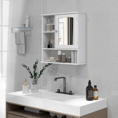 a white sink sitting under a bathroom mirror next to a wooden shelf filled with bottles