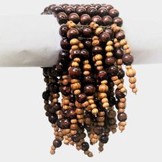 If you wish to achieve a stunning party look with something a little different, our Okore Multistrand Cluster Bracelet will not disappoint! Incorporating stunning Brown Wood beads of light and dark shades, and Pearl this cluster vine bracelet oozes style and panache. Is elastic threads is versatile to fit different hand sizes. It has been skillfully put together, with careful detail to attention, by our dedicated and capable artisans. Pair this stunning article with our breathtaking Bronze/Golde Vine Bracelet, Pearl Bib Necklace, Cluster Bracelet, Cluster Bracelets, Elastic Thread, Multi Strand Bracelet, Party Look, Light And Dark, Dark Shades