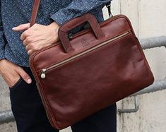 a woman carrying a brown leather briefcase