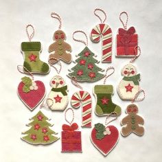 christmas ornaments made from felt on a white background