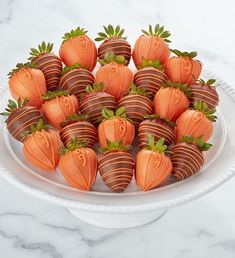 chocolate covered strawberries arranged on a white platter