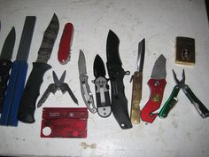 there are many different types of knifes on the counter top, including scissors and knives